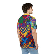 Person wearing a colorful geometric patterned shirt on a white background