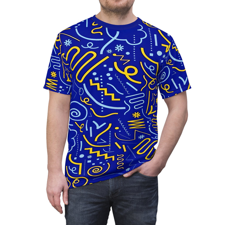 Person wearing a blue t-shirt with yellow and white abstract patterns on a white background