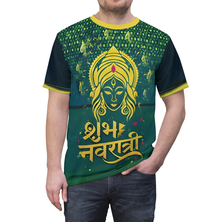 Person wearing a green and yellow t-shirt with a deity design and text.