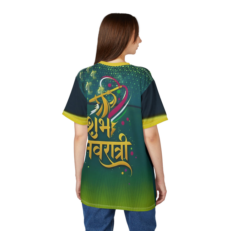 Woman wearing a green and blue shirt with colorful text on the back