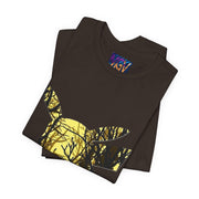 Folded black t-shirt with a tree design on a white background